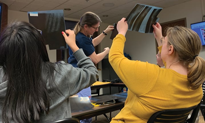 healthcare-CTE-students-looking-at-x-rays-in-classroom